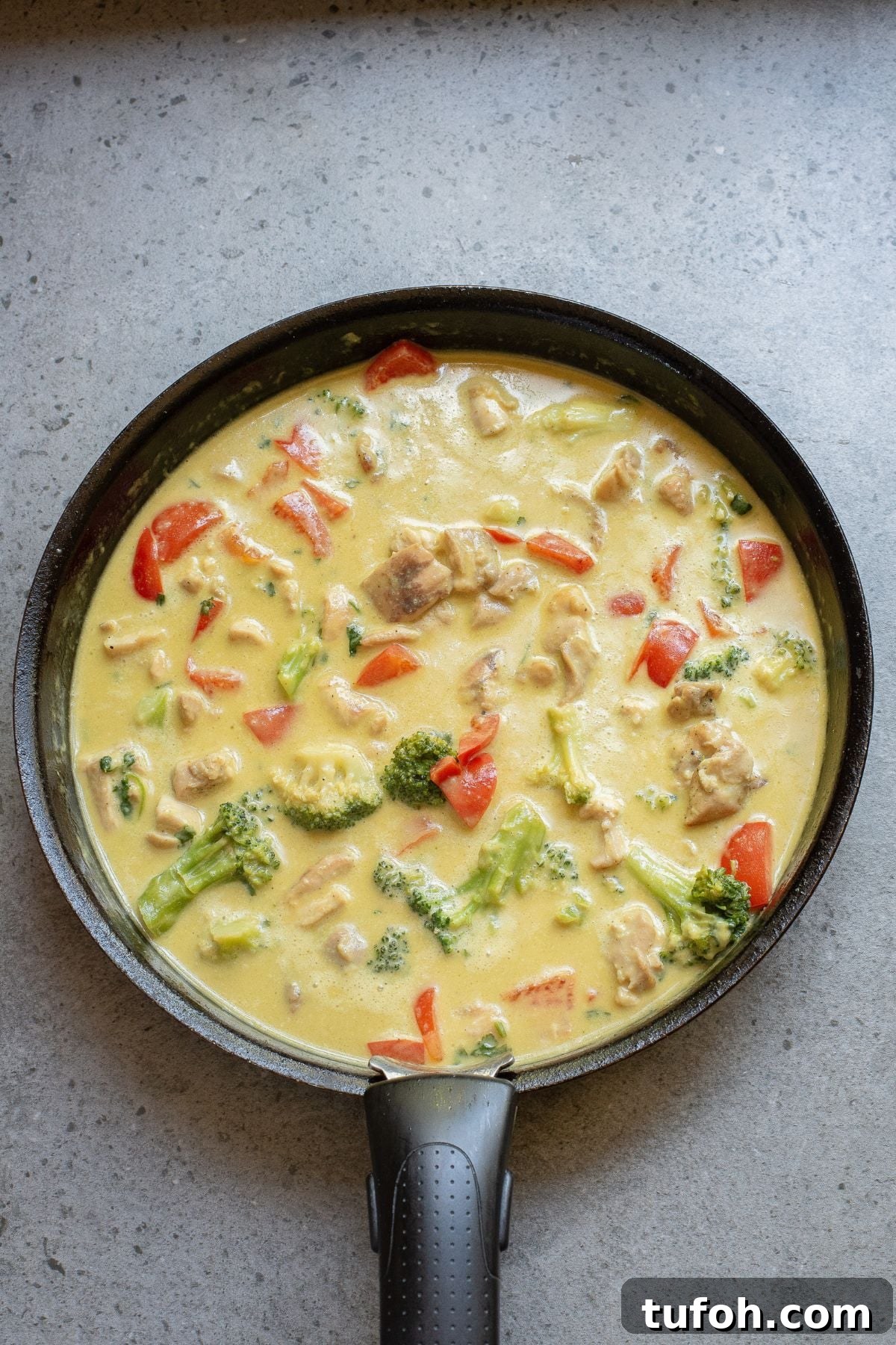 Curry simmering in skillet