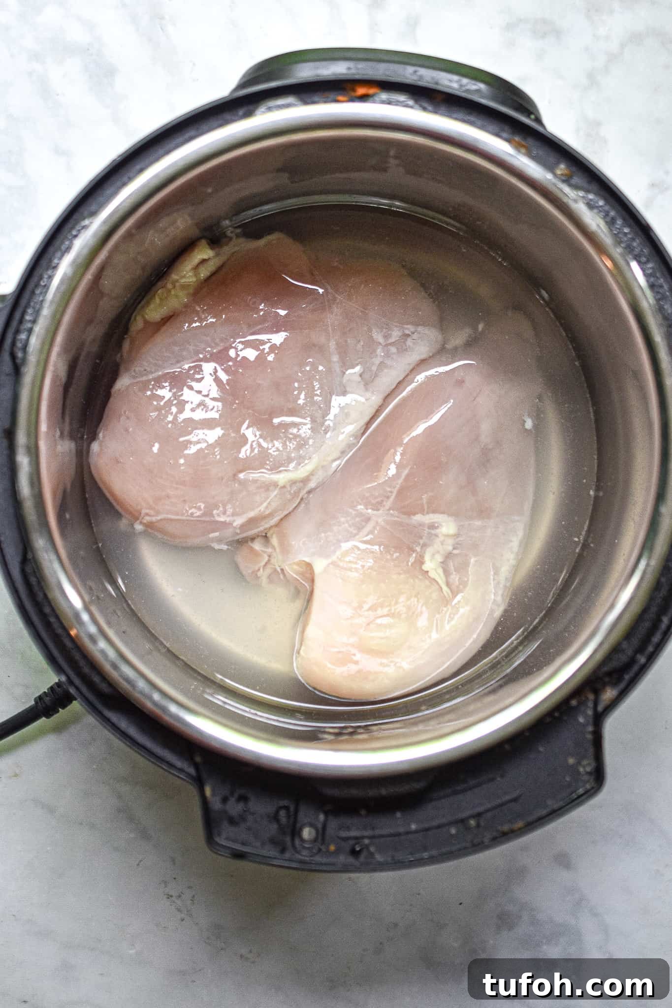 Instant Pot Chicken Salad Recipe for Quick Weeknight Meals 5 The chicken is added to the instant pot.