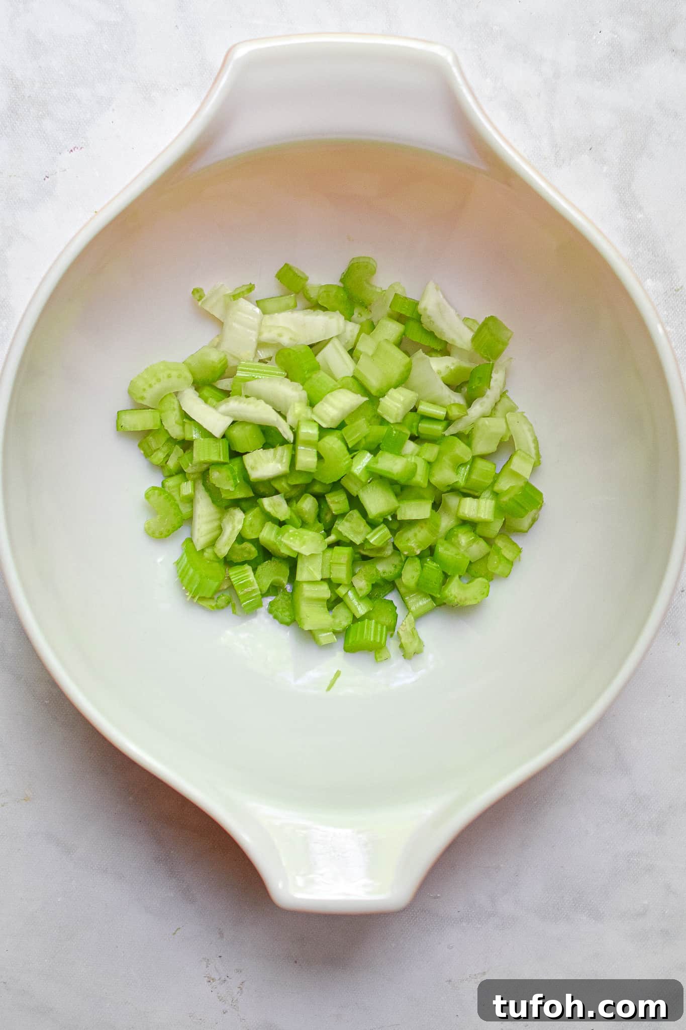 Instant Pot Chicken Salad Recipe for Quick Weeknight Meals 6 The celery is chopped and added to a bowl.
