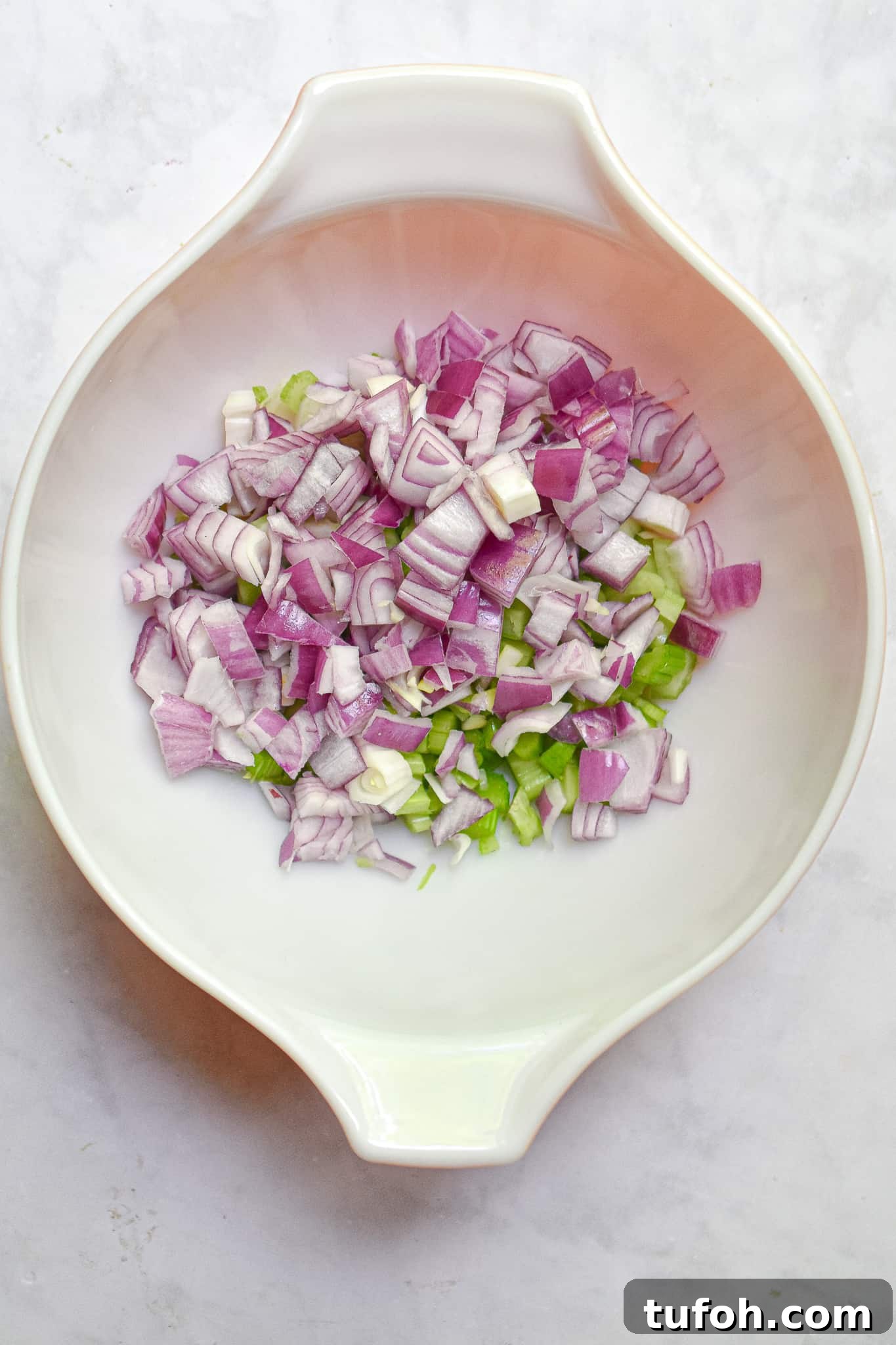 Instant Pot Chicken Salad Recipe for Quick Weeknight Meals 7 The red onion is added to the bowl.