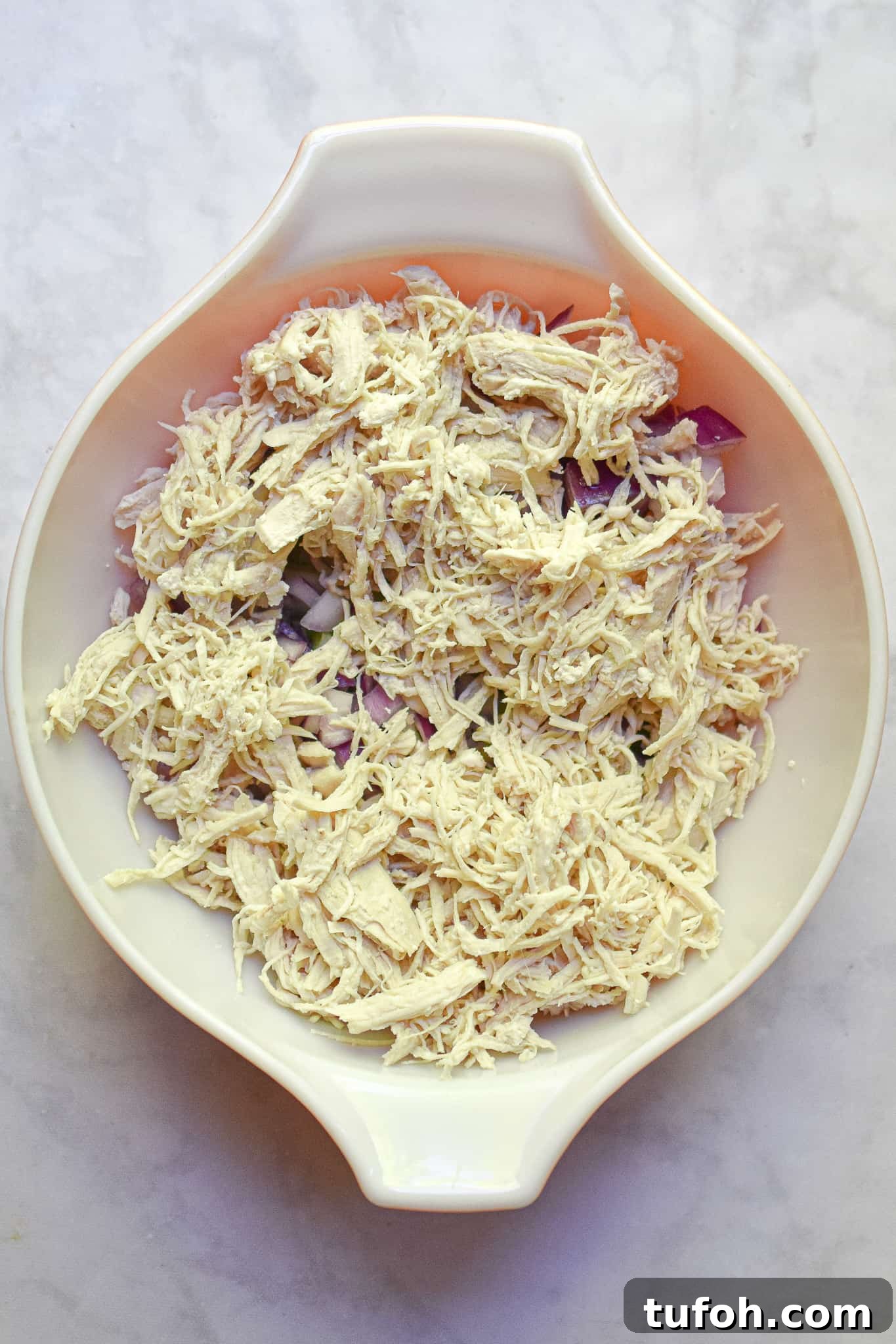 Instant Pot Chicken Salad Recipe for Quick Weeknight Meals 9 The shredded chicken is added to the bowl