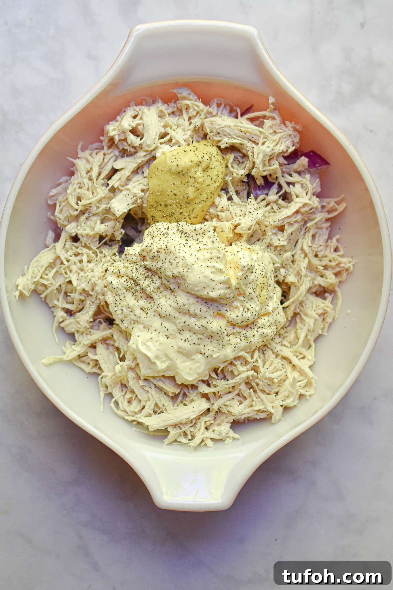 Instant Pot Chicken Salad Recipe for Quick Weeknight Meals 10 The mayo and mustard are added to a bowl.