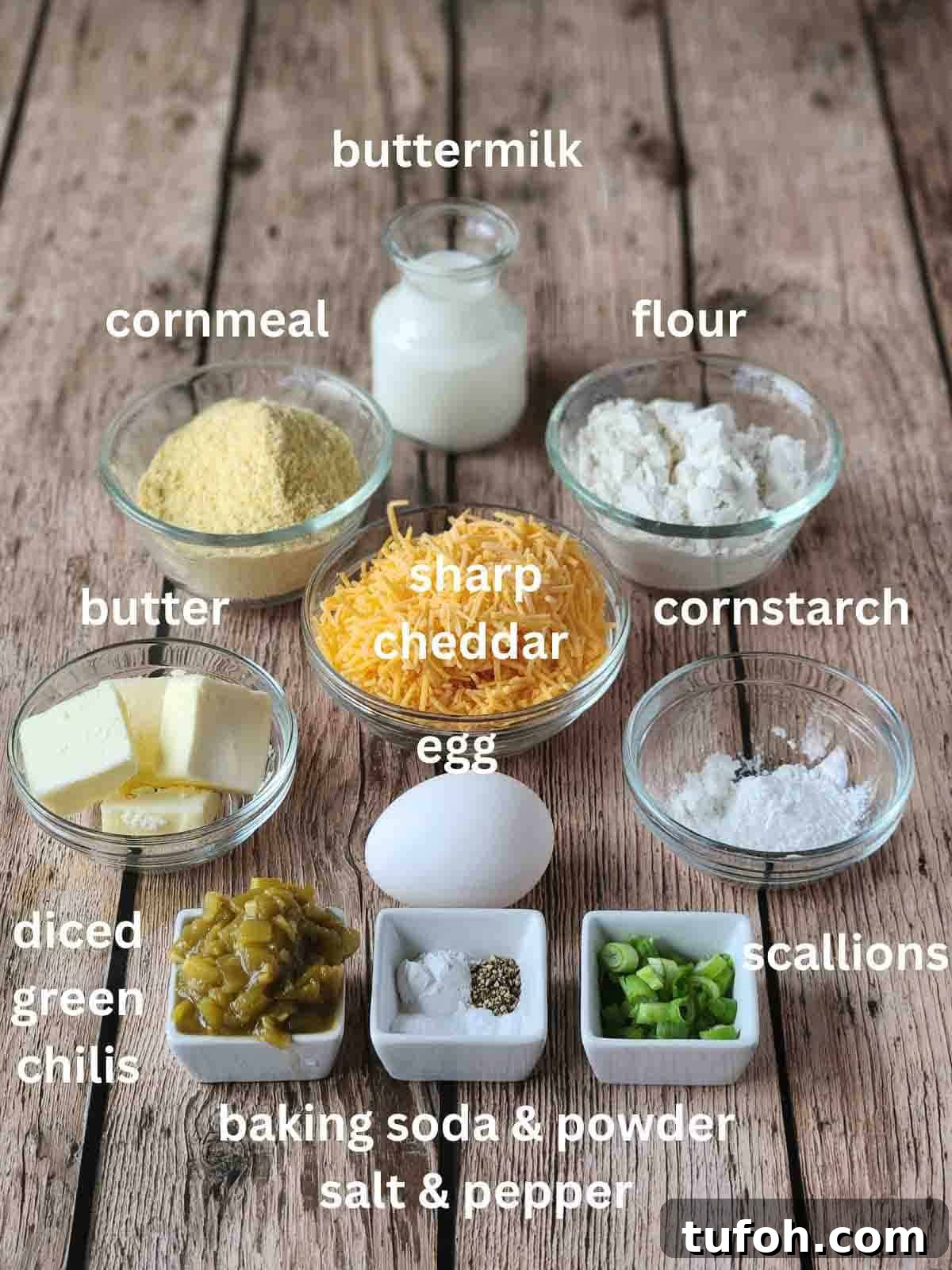 Spicy Green Chili Cheddar Waffles for Savory Brunch 3 Labeled ingredients in small bowls for savory waffles on a wood surface.