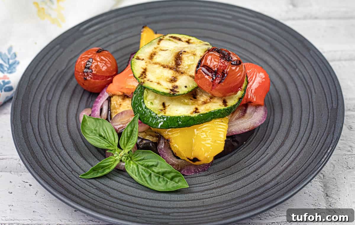 17 Crowd-Pleasing Backyard BBQ Recipes for Seconds-Worthy Meals 12 Close-up shot of Grilled Ratatouille on a black plate.