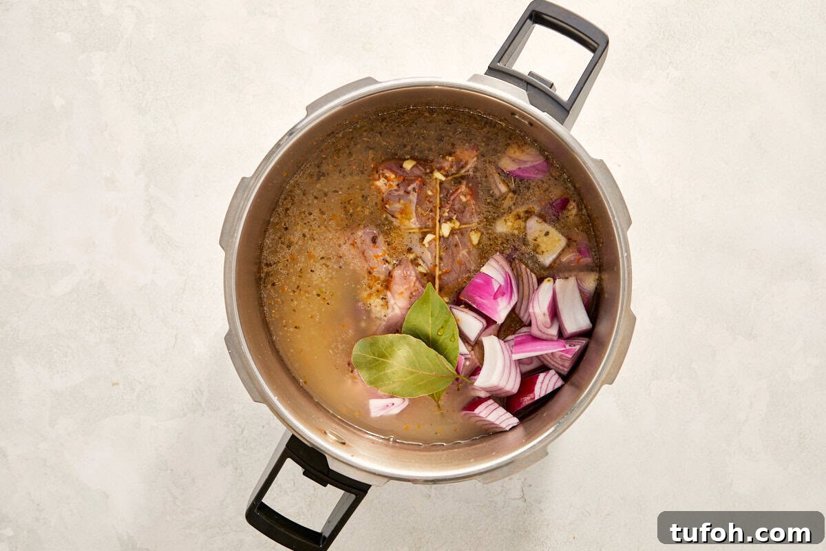 Pork with onions and bay leaves in a pot