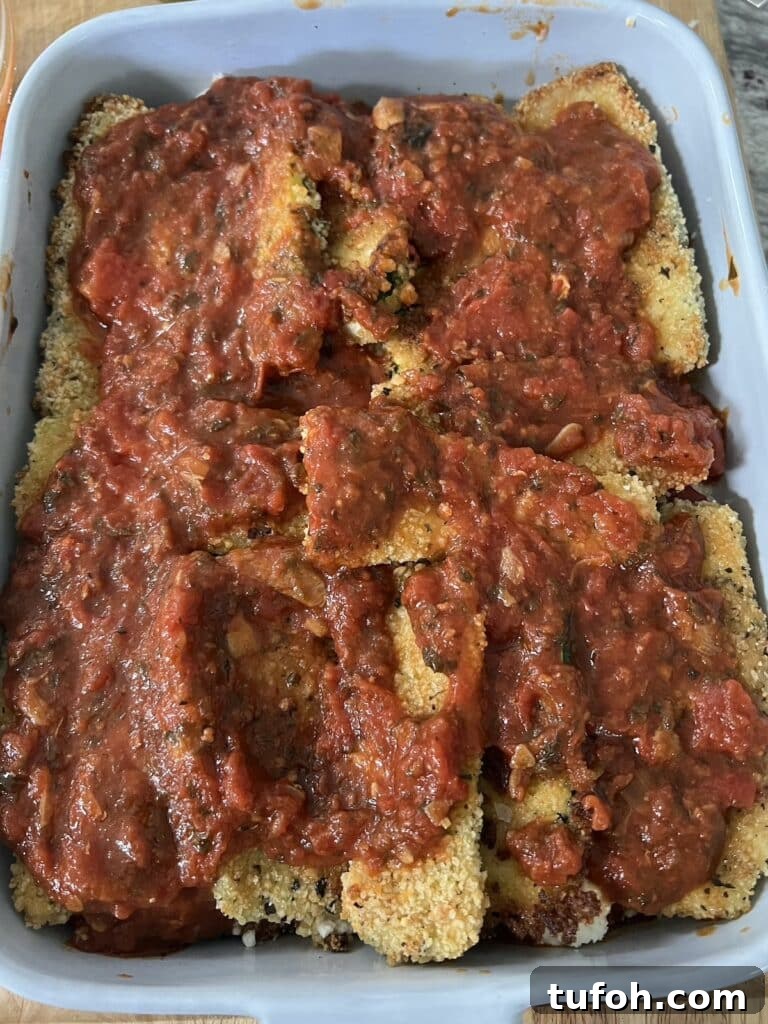 Zucchini Parmigiana with Ricotta: Layered Baked Zucchini Parmesan 15 More tomato sauce added.