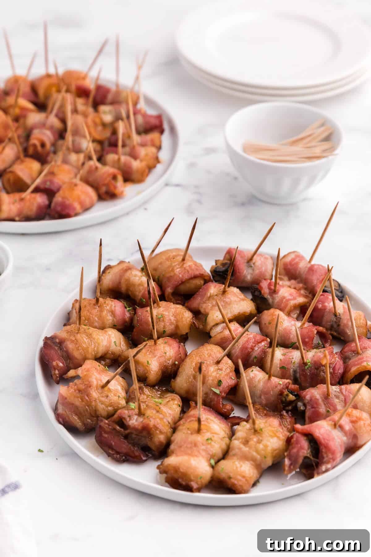 Bacon Wrapped Appetizers - Bite sized and addicting! Try four varieties - bacon wrapped water chestnuts, bacon wrapped smoked oysters, bacon wrapped pineapple and bacon wrapped olives.