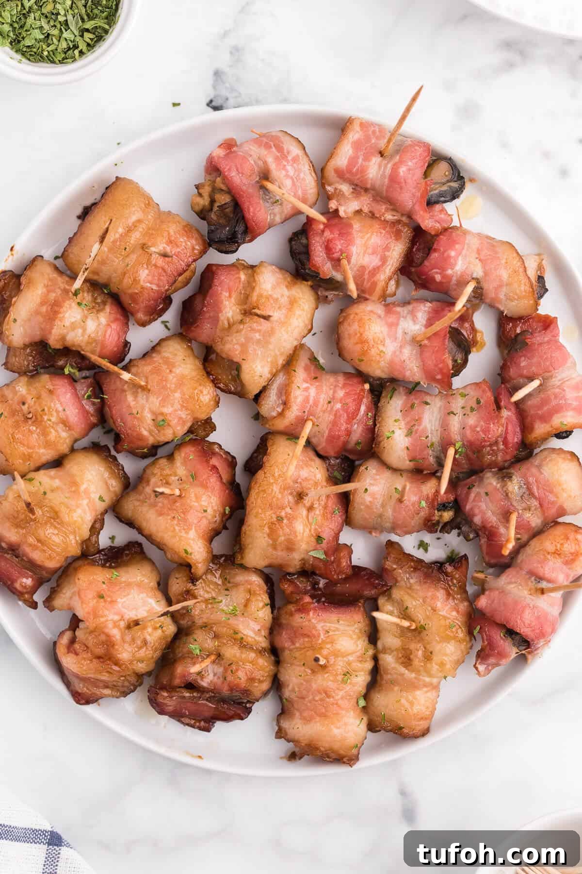 Bacon Wrapped Appetizers - Bite sized and addicting! Try four varieties - bacon wrapped water chestnuts, bacon wrapped smoked oysters, bacon wrapped pineapple and bacon wrapped olives.