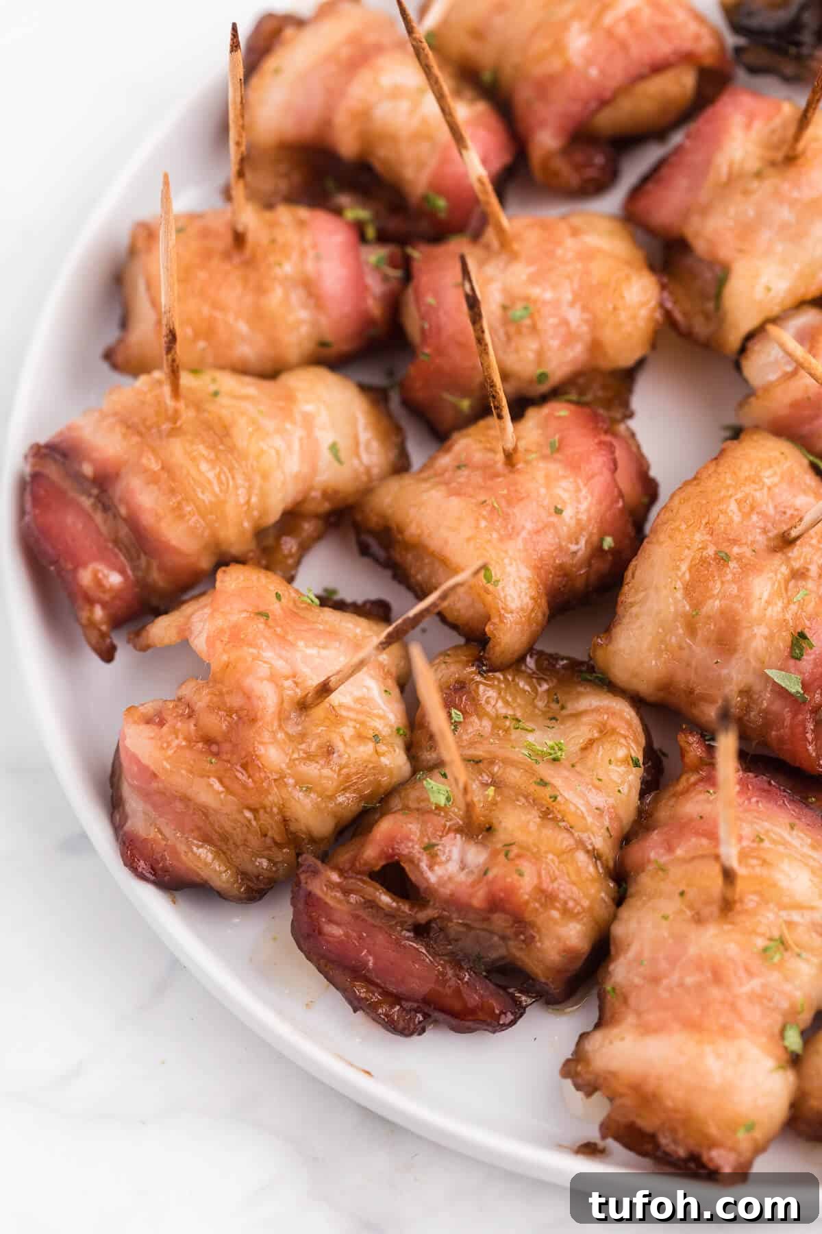 Bacon Wrapped Appetizers - Bite sized and addicting! Try four varieties - bacon wrapped water chestnuts, bacon wrapped smoked oysters, bacon wrapped pineapple and bacon wrapped olives.