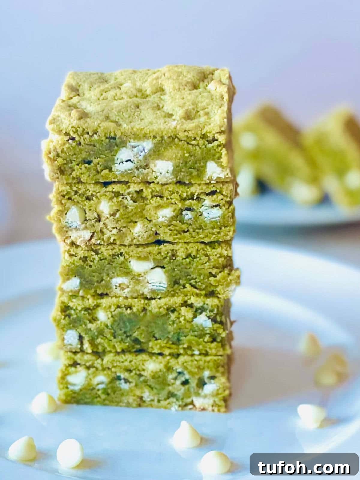 Chewy Matcha Brownies Recipe with Rich Green Tea Flavor 2 matcha brownies in a stack on a plate