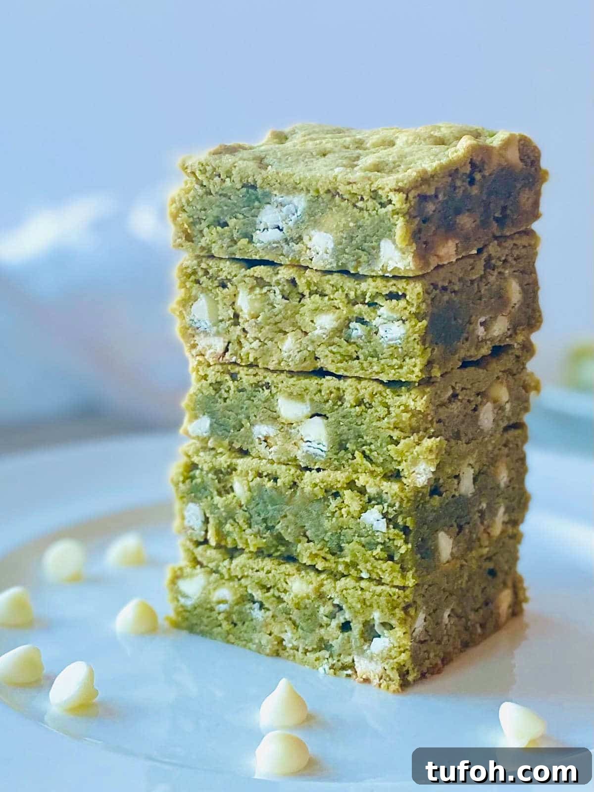 Chewy Matcha Brownies Recipe with Rich Green Tea Flavor 3 matcha white chocolate brownies in a stack