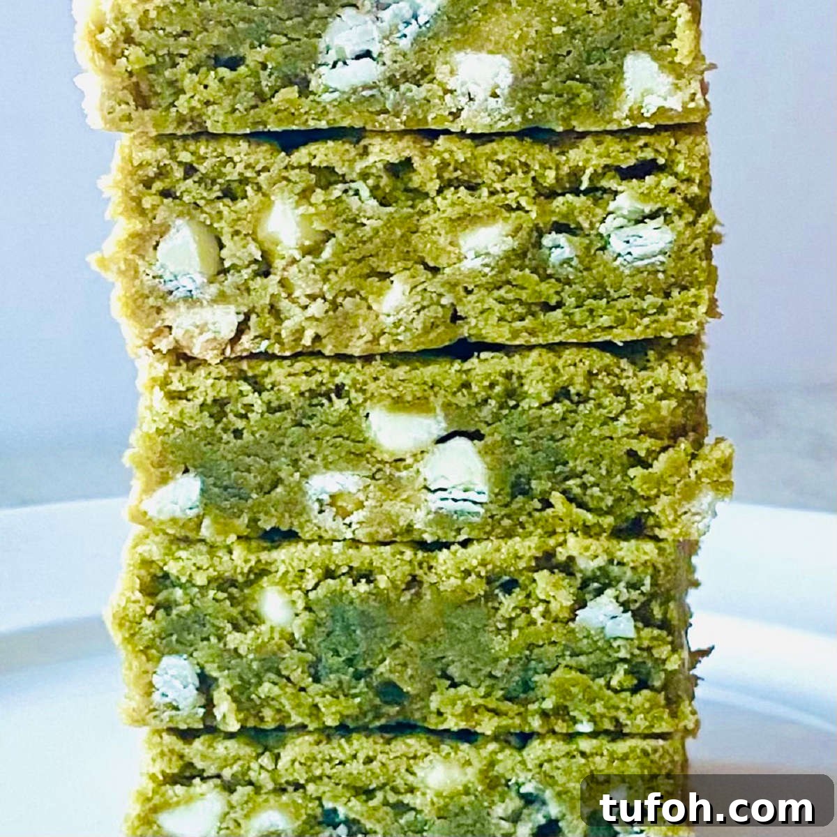 Chewy Matcha Brownies Recipe with Rich Green Tea Flavor 6 white chocolate matcha brownies close up