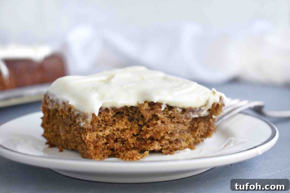 slice of gingerbread cake with bite out of it on plate