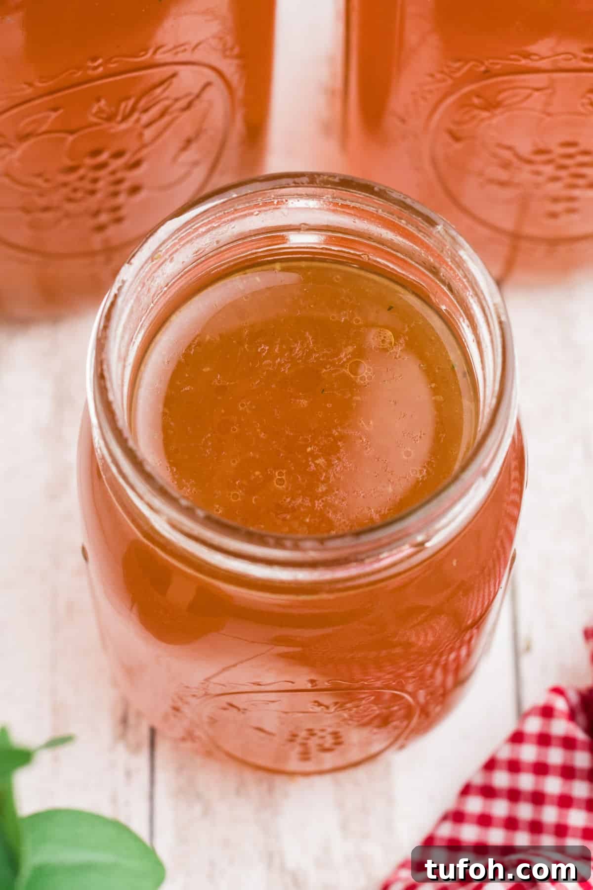 Savory Rotisserie Chicken Bone Broth Recipe for Rich Flavor 2 Overhead shot of an open mason jar of Rotisserie Chicken Bone Broth.