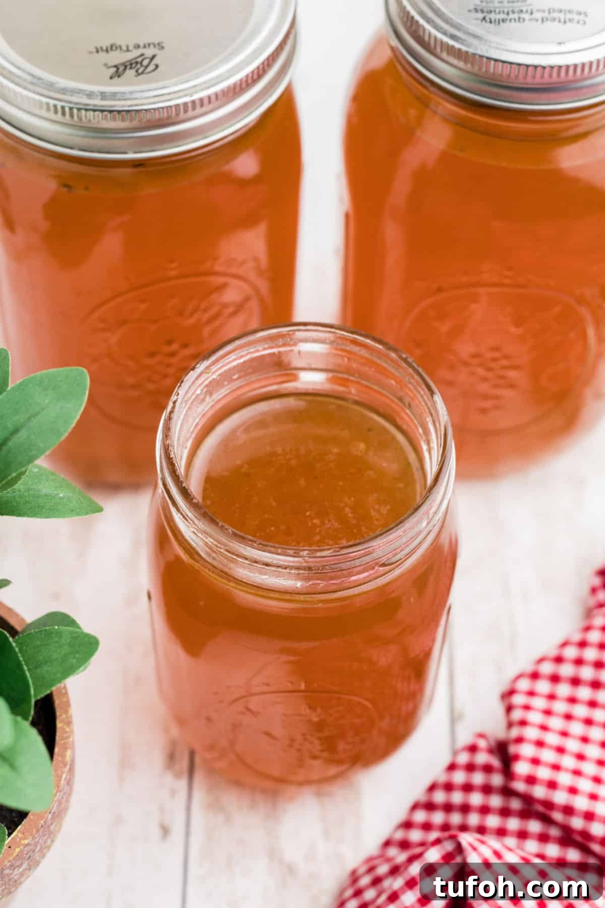 Savory Rotisserie Chicken Bone Broth Recipe for Rich Flavor 6 Overhead shot of an open mason jar of Rotisserie Chicken Bone Broth.