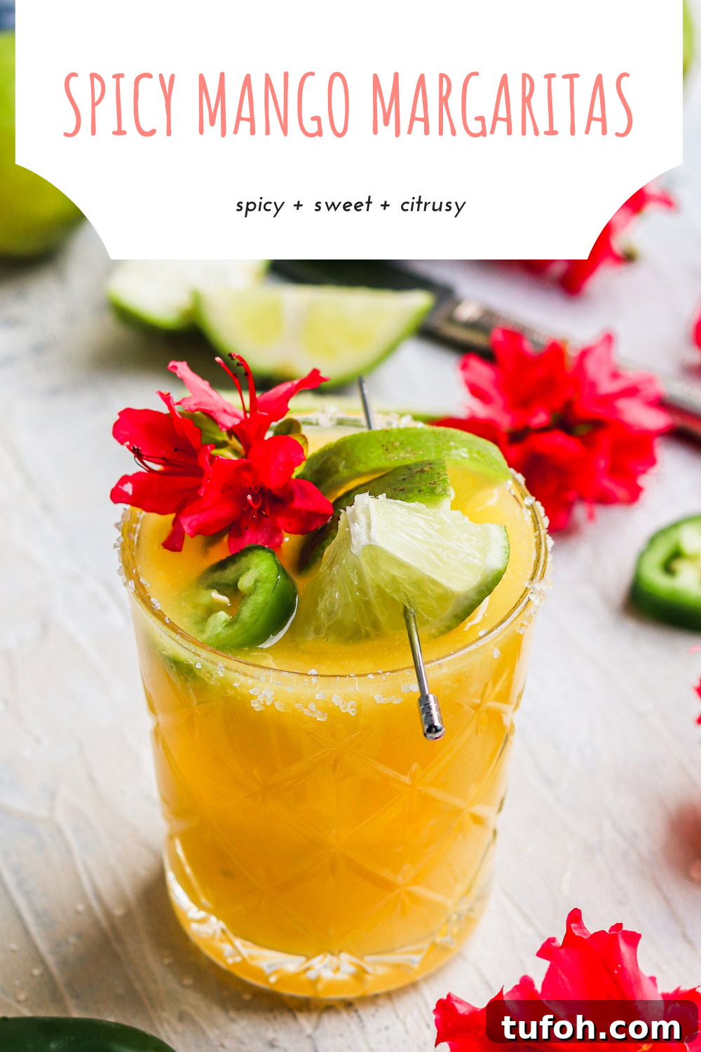 Spicy mango margaritas are perfect for summer! This is the perfect margarita recipe, subtly spicy and perfectly sweet, this is a great margarita recipe! #mangomargaritas #margaritarecipe