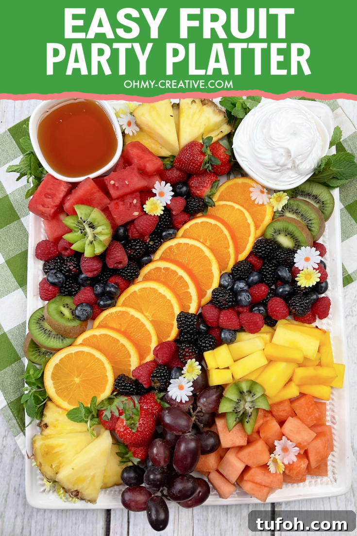 Easy Fruit Party Platter with oranges, berries, kiwi, pineapple and more.