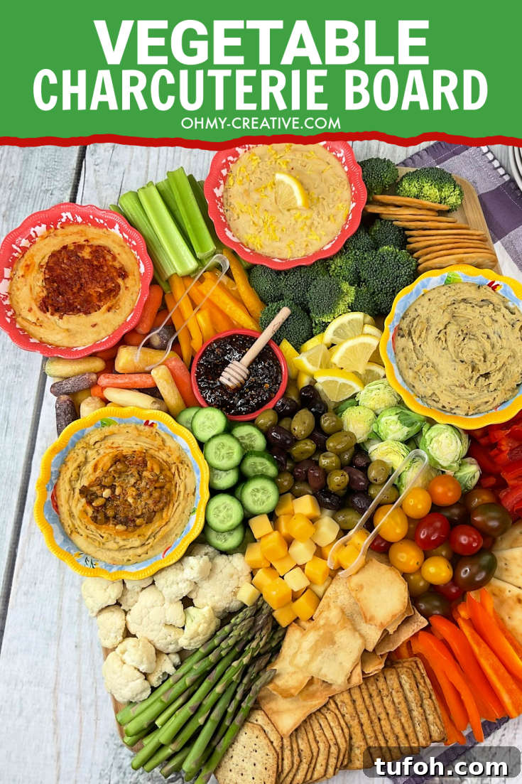 A healthy vegetable veggie charcuterie board that includes celery, grape tomatoes, carrots and more.