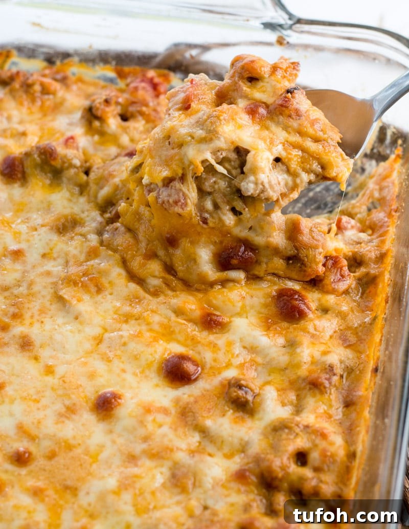 This low carb Keto Taco Zoodle Casserole has all the flavor of taco mac without the carbs! Zucchini noodles, taco meat and a rich cheese sauce are baked until bubbly! The ultimate keto comfort food!