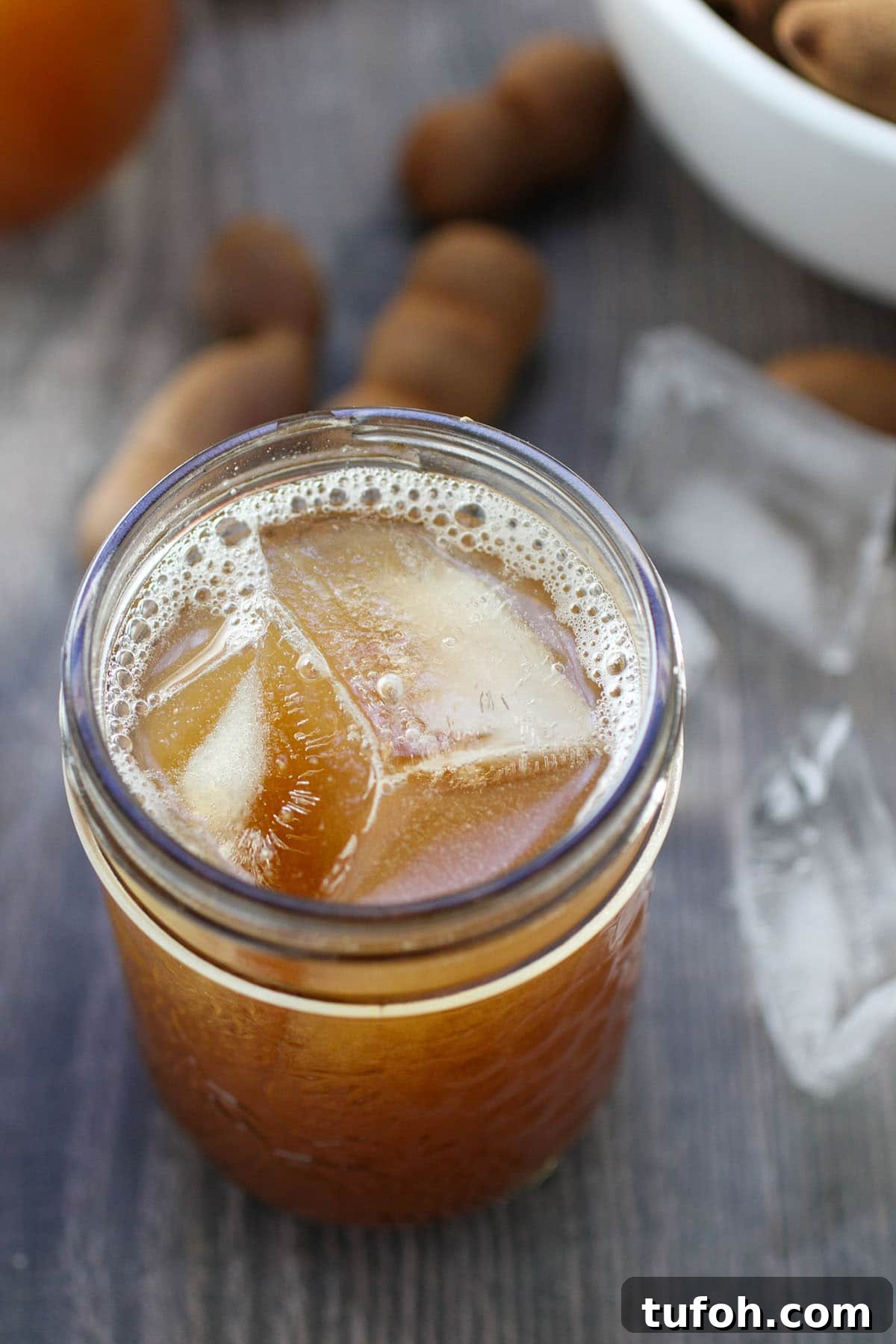 tamarind drink with ice in a clear glass