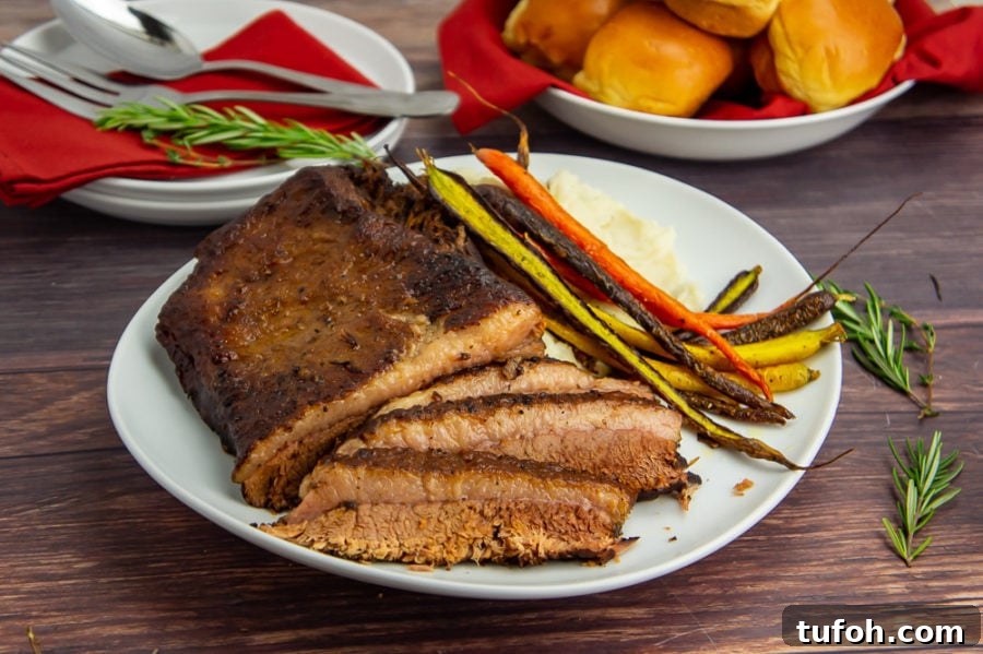 a platter of sliced brisket with roasted carrots on a wooden table