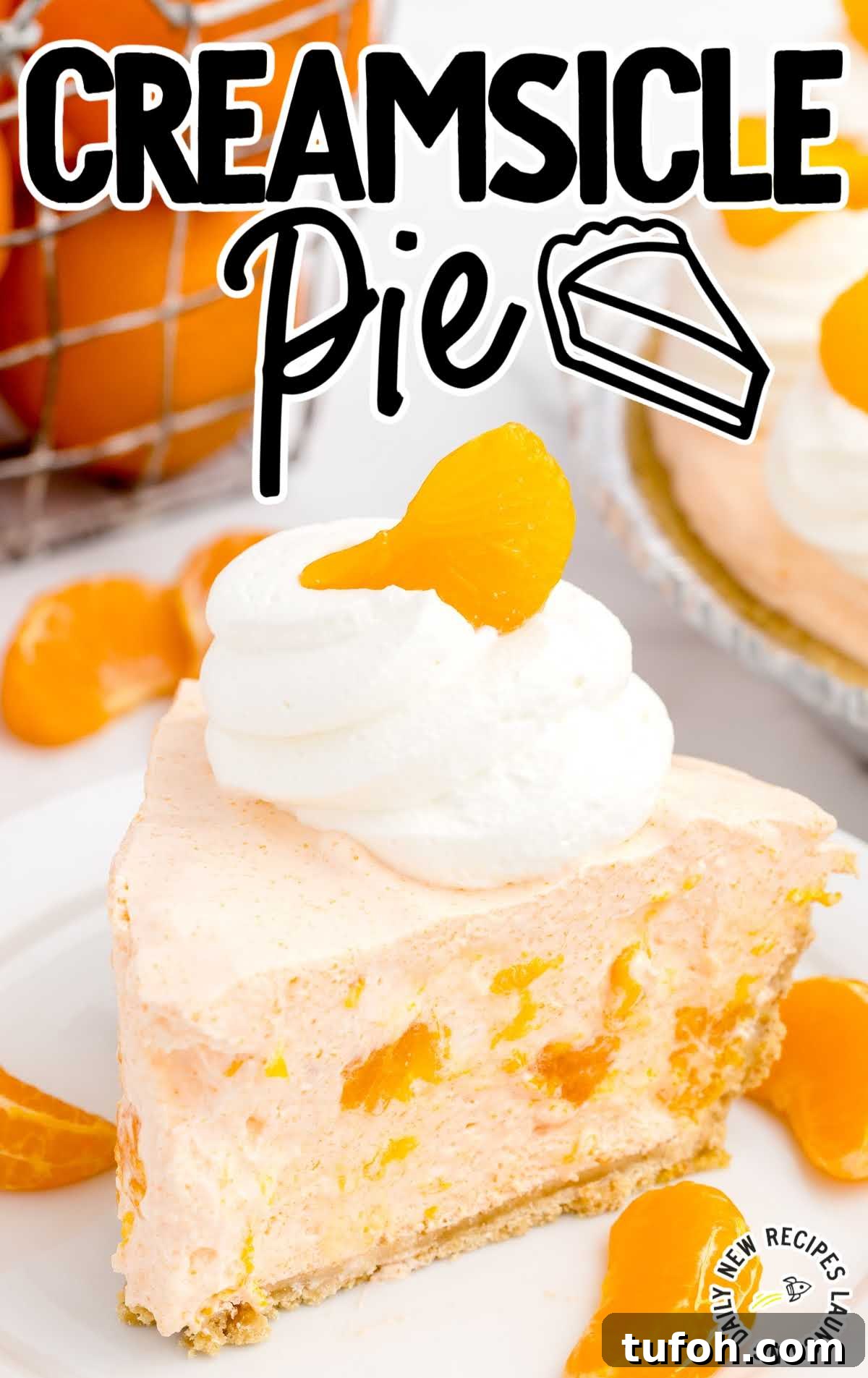 close up shot of a slice of pie topped with whipped cream and a mandarin orange on a plate
