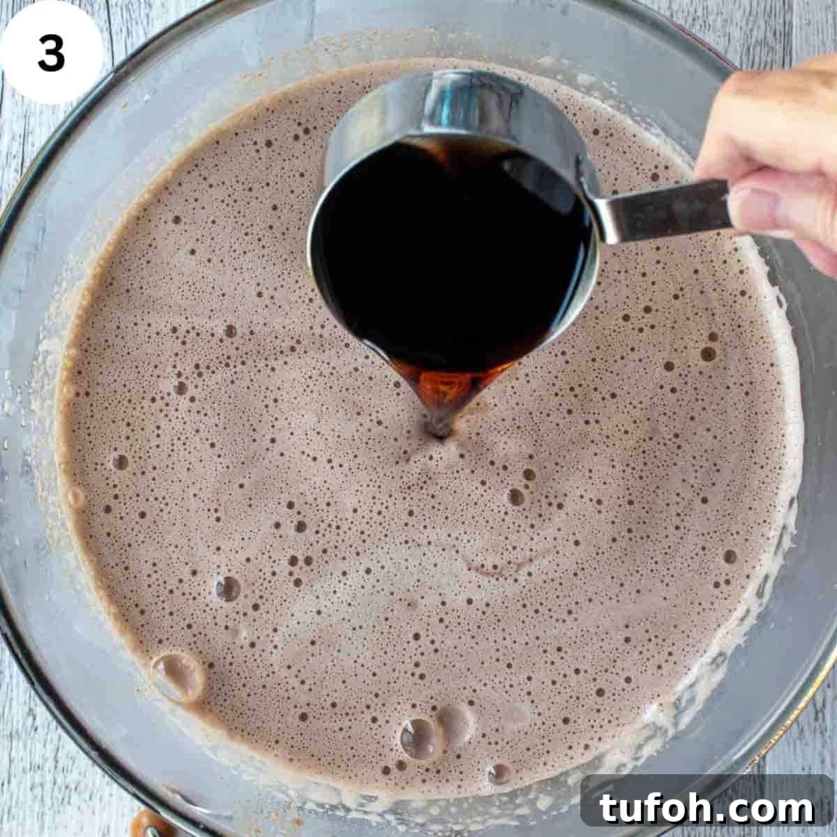 Add dark wine to a frothy milk mixture.