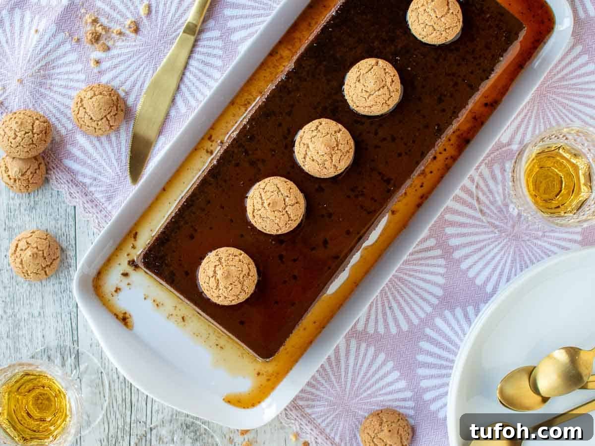 Overhead view of chocolate cream caramel dessert with amaretti cookies lined on top.