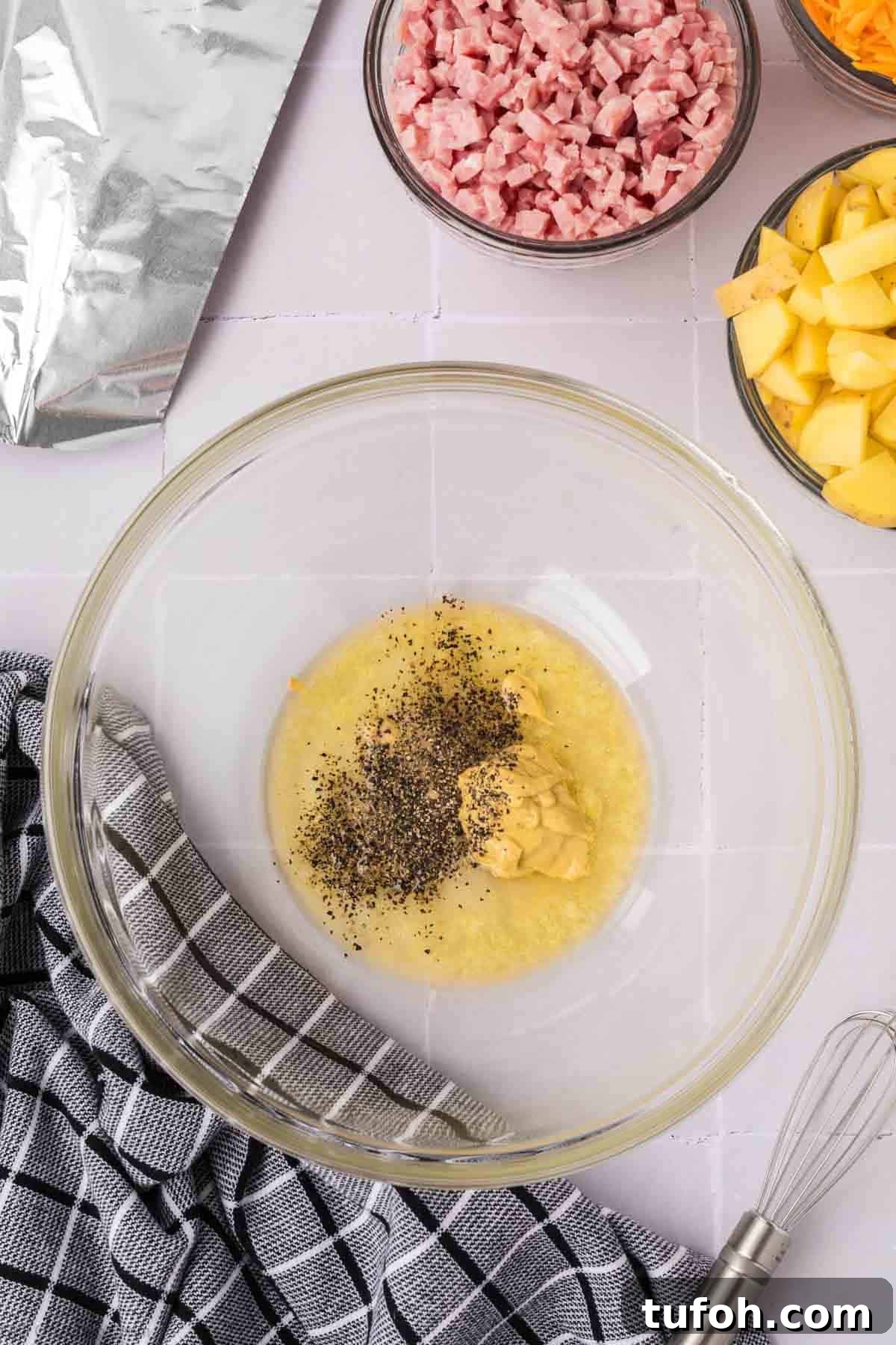 Mixed melted butter, mustard, salt, and pepper in a bowl