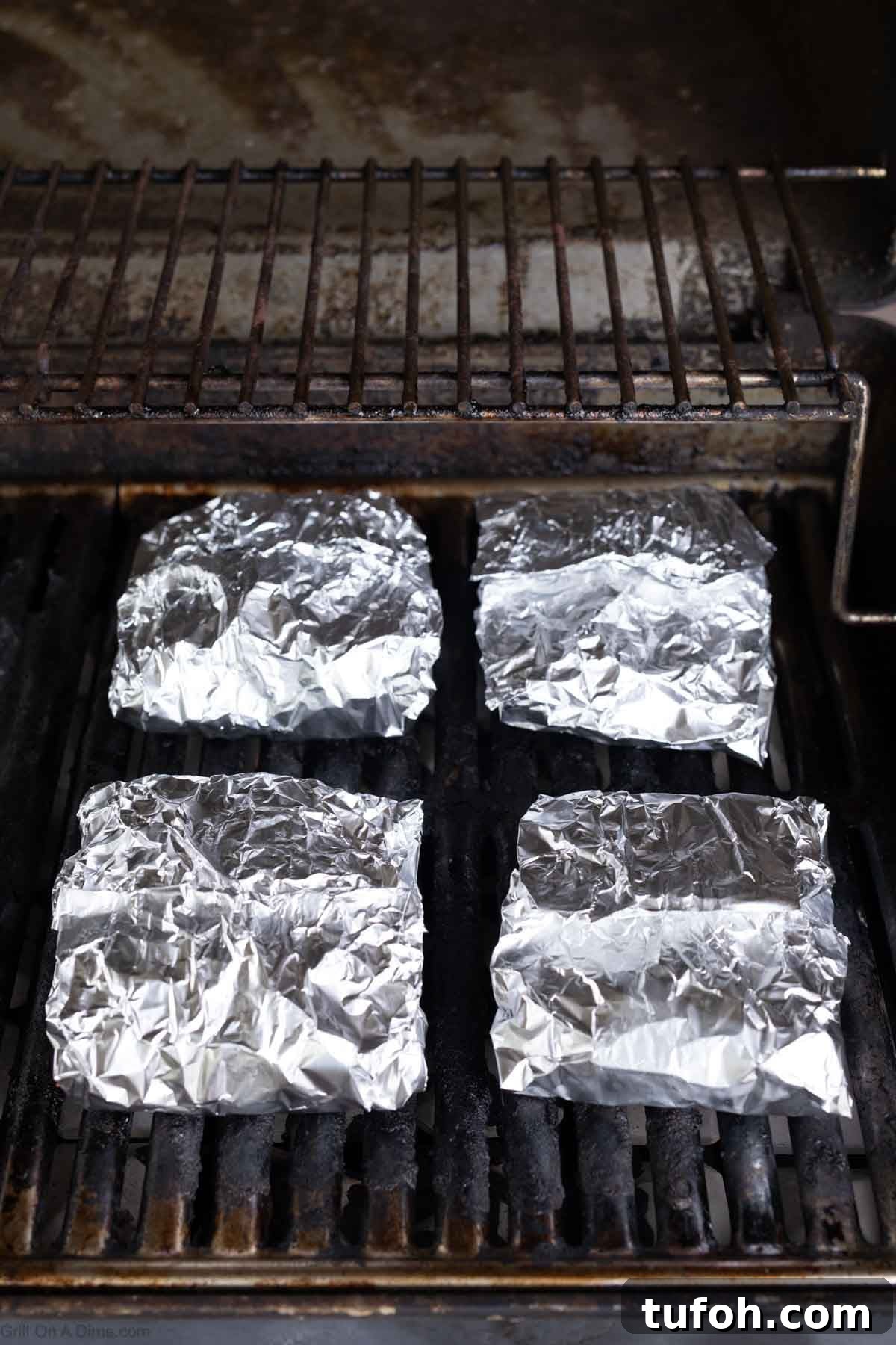 Foil packets on the grill grates