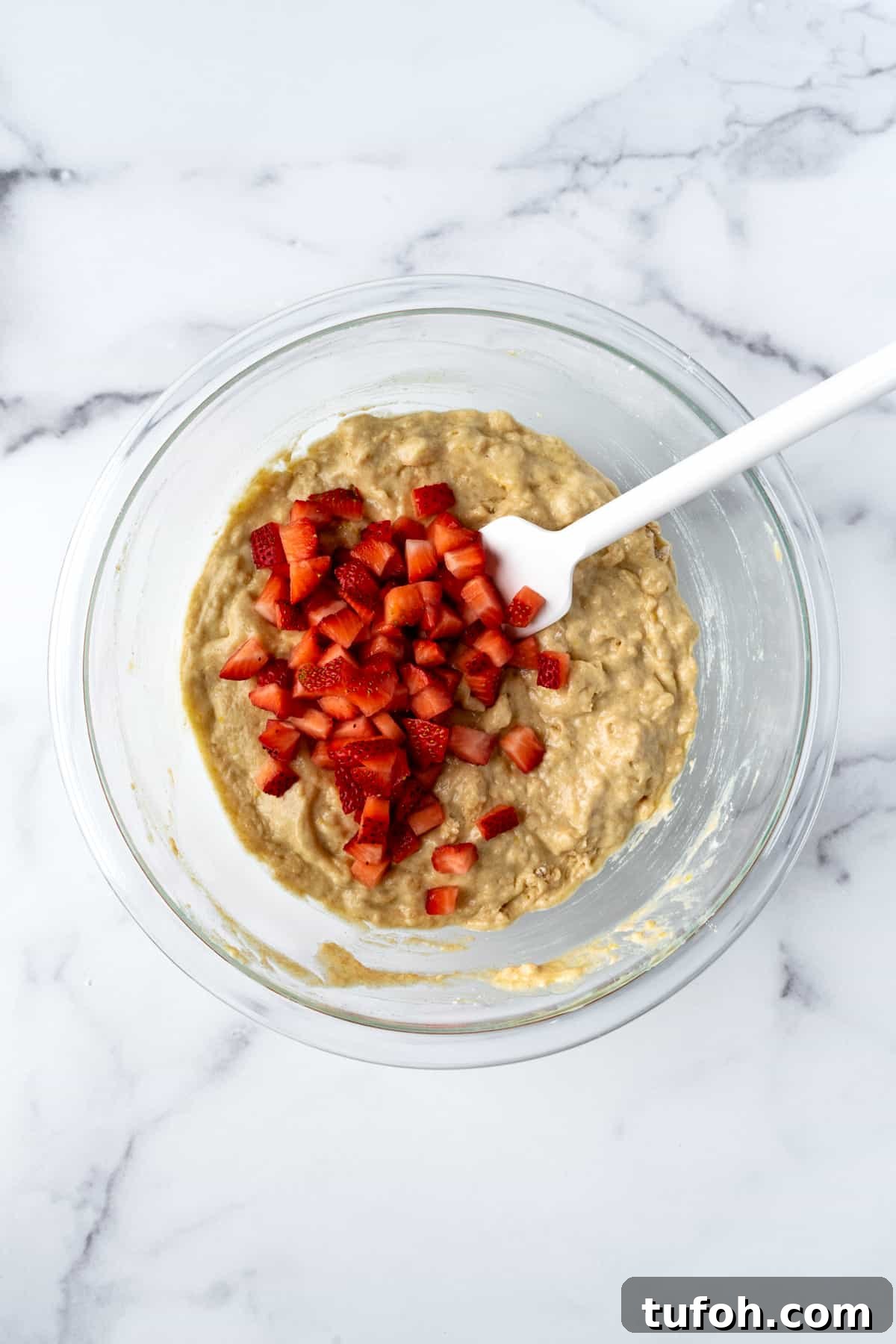 Strawberry Lemon Muffins Batter in a glass mixing bowl.