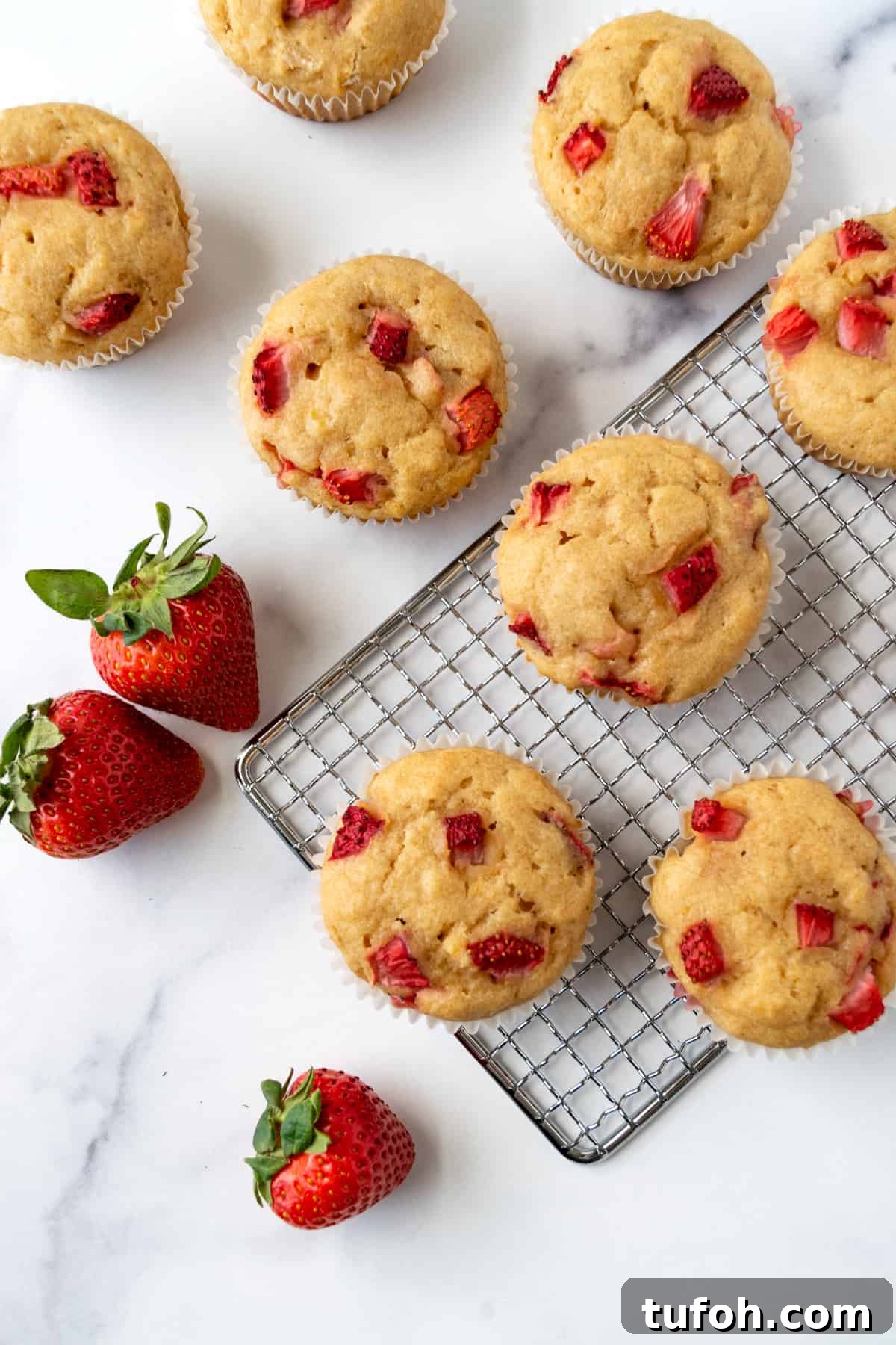 Strawberry Lemon Muffins on a wire rack.