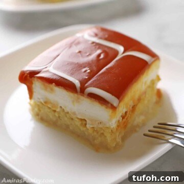 A piece of trileche on a white plate.