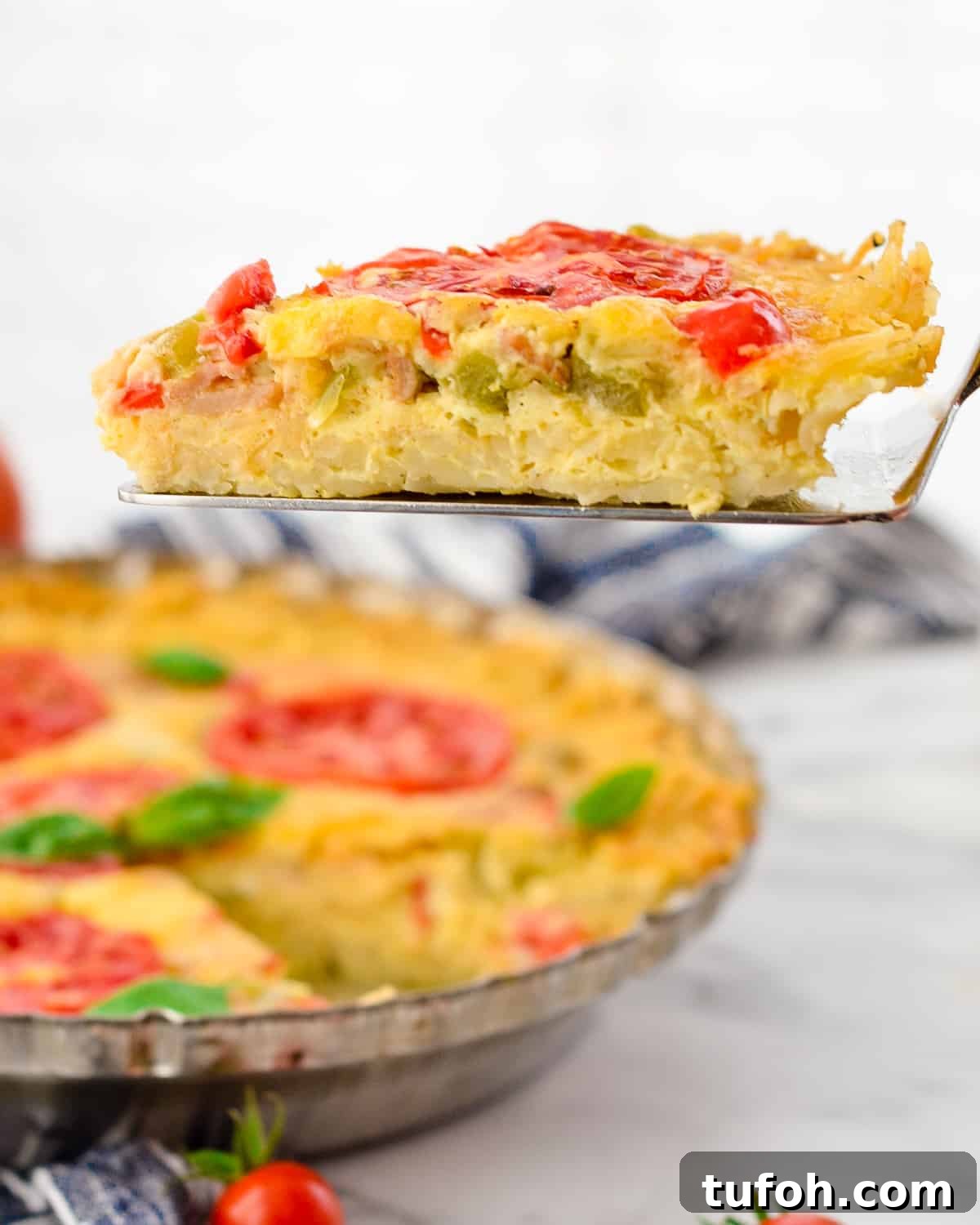 Side view of a one piece of Gluten-Free Hash Brown Quiche 