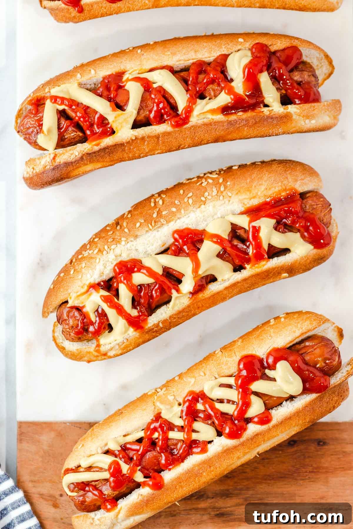 air fryer hot dogs with mustard and ketchup.